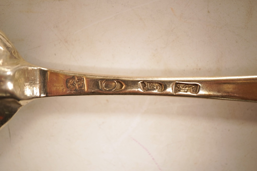 An 18th century Irish? provincial silver Hanoverian pattern tablespoon, maker's mark stamped twice 'I.T with crown above and mullet below' and 'Sterling', 20.9cm, together with eight assorted 18th century silver rat tail